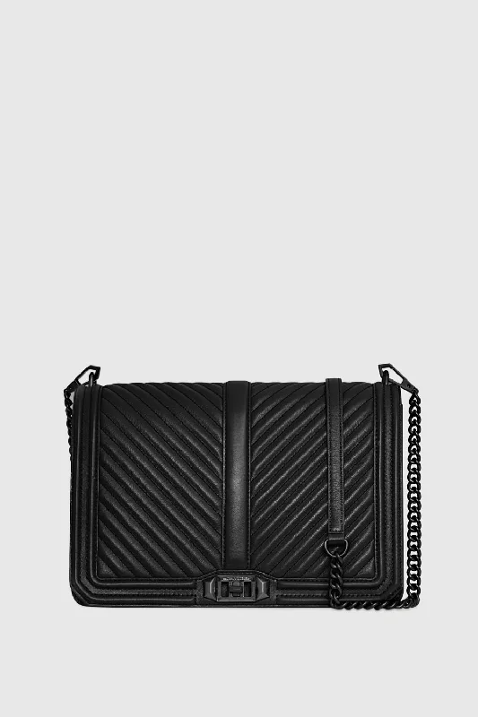 Senior Travelers Chevron Quilted Jumbo Love Crossbody Bag In Black/Black Shellac